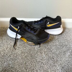 Nike Black and Gold Sneakers with White Soles